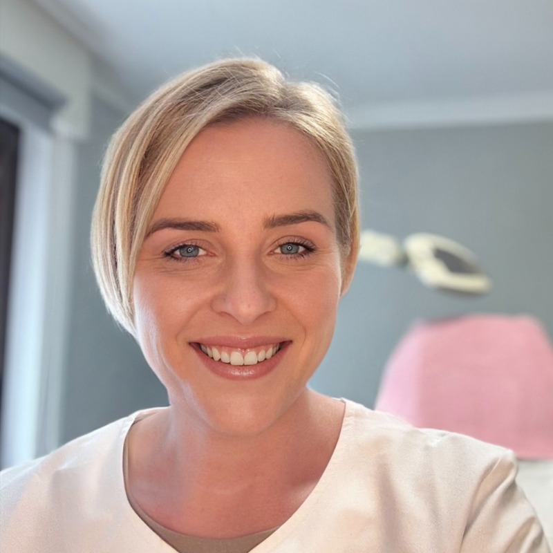 Person in a light-colored top.