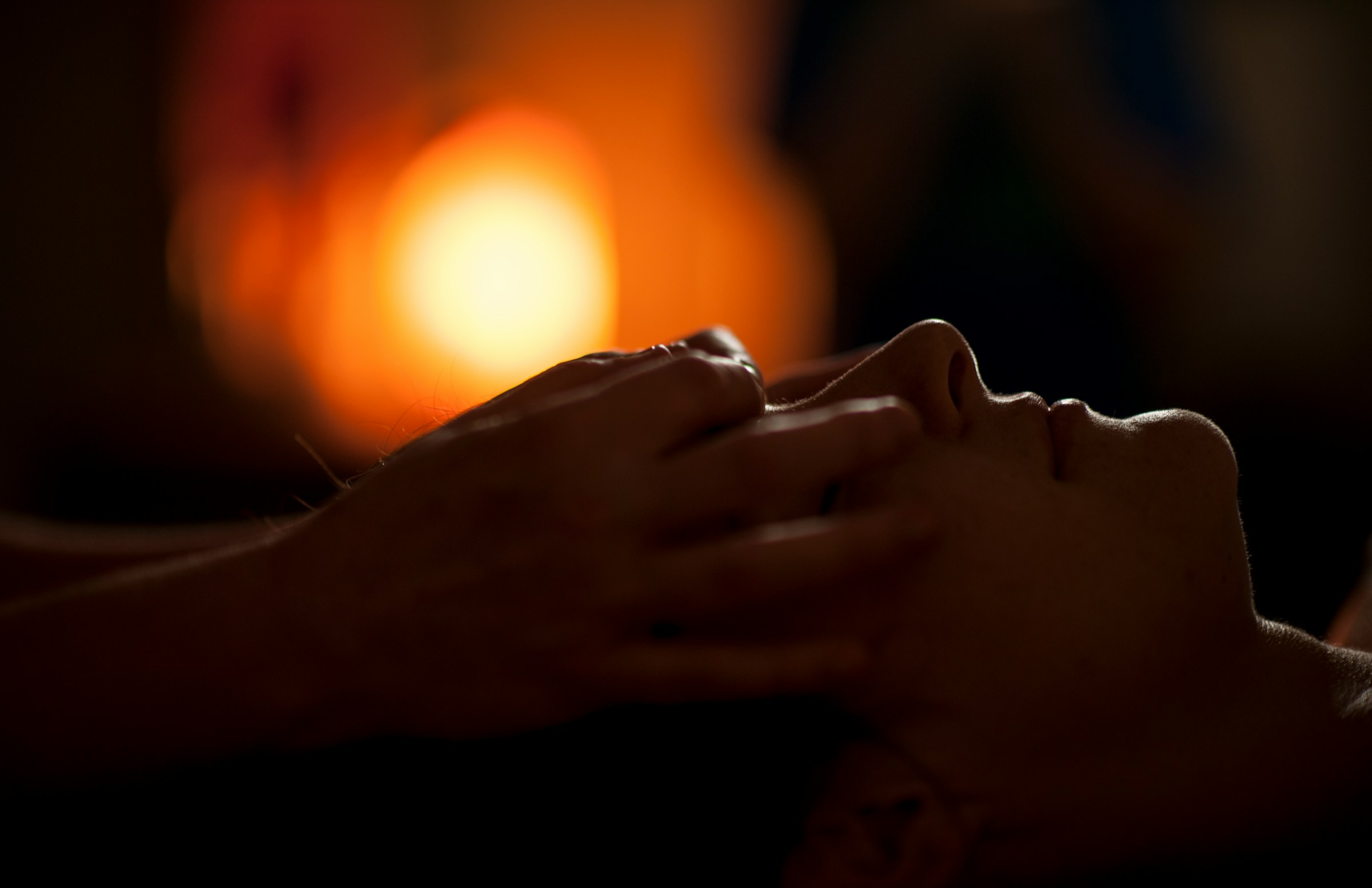 Person receiving a facial massage.