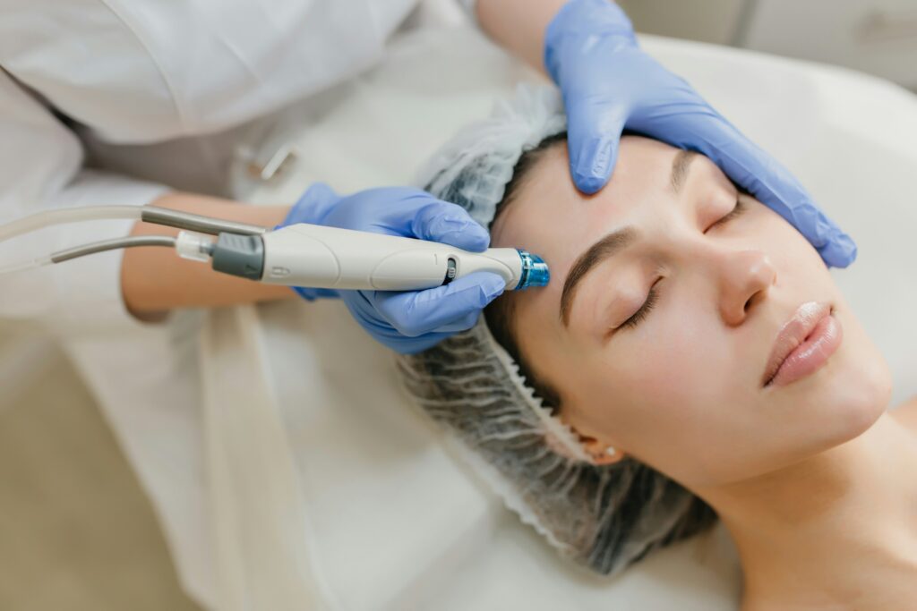 Woman receiving facial treatment procedure